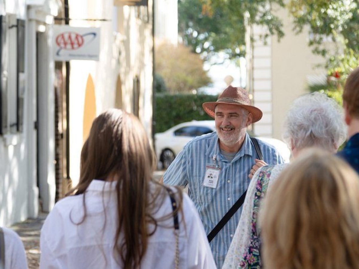 a group of people standing next to a person