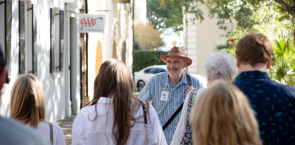 a group of people standing next to a person