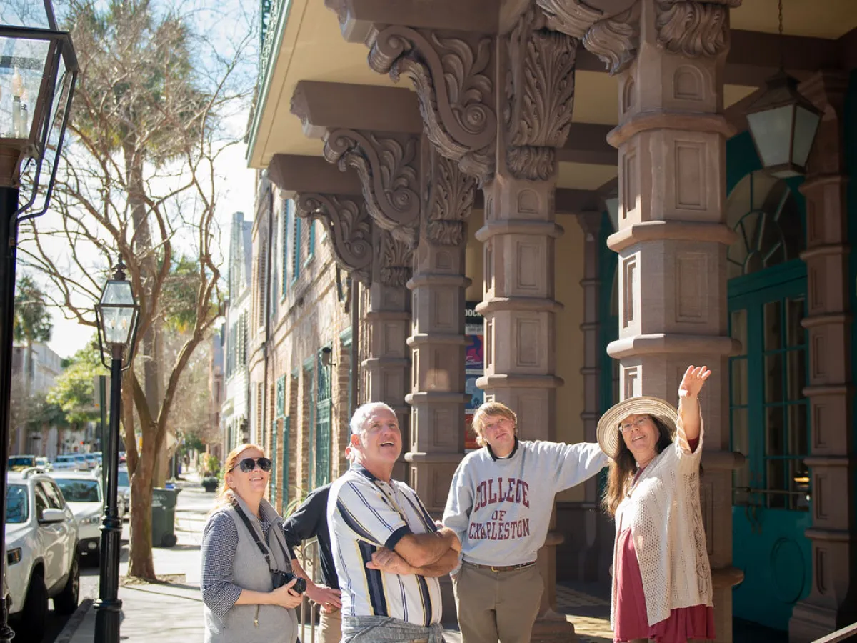 a group of people on a sidewalk