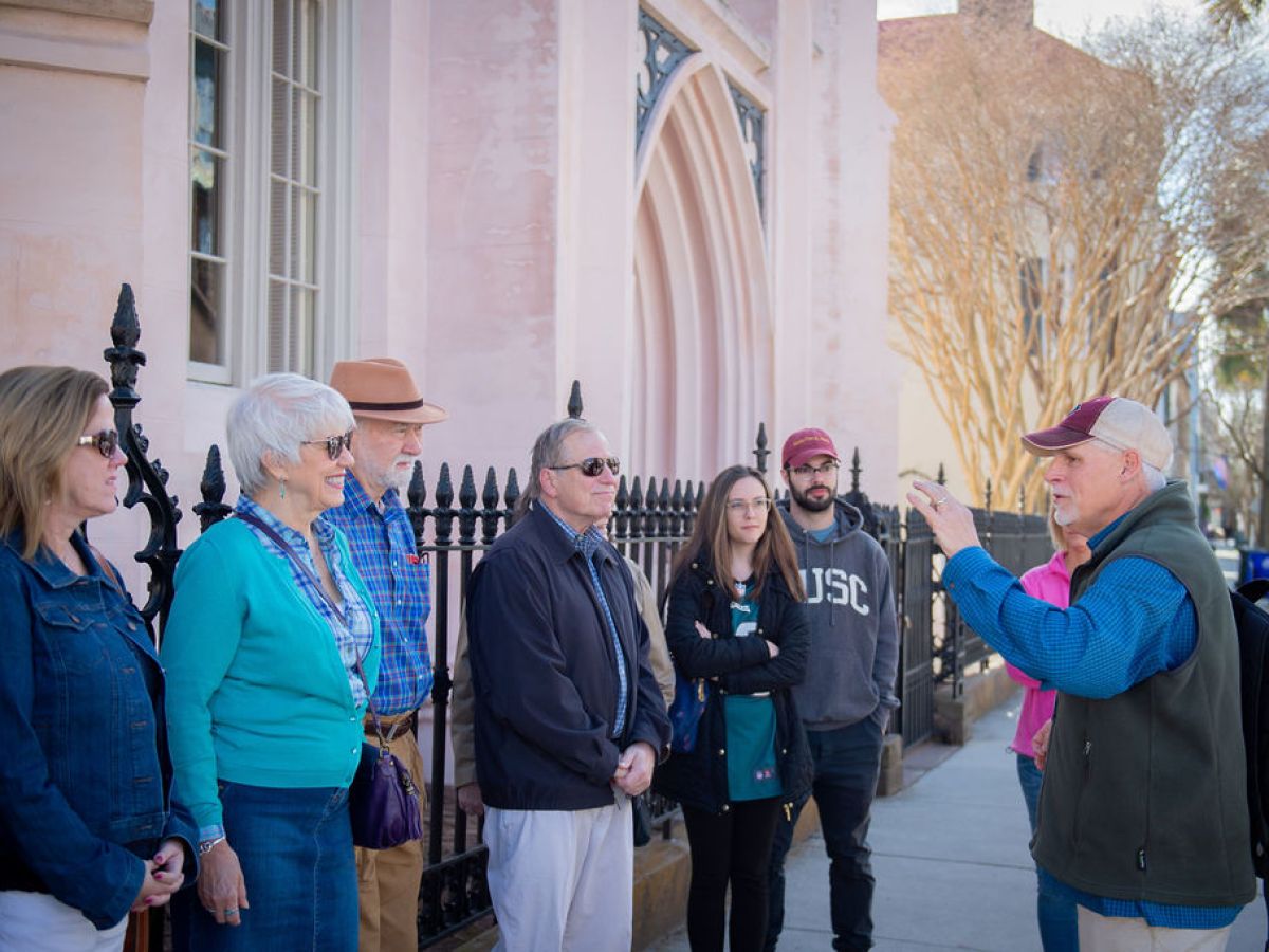 a group of people standing in front of a building