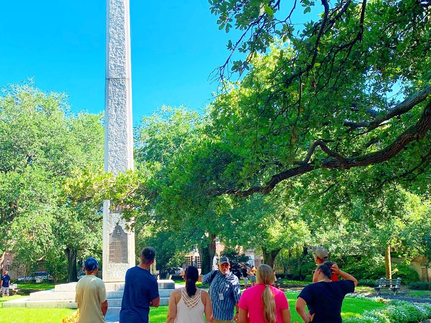 a group of people standing in a park